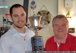 Riverhead Raceway’s Bob Finan (right) presents 2012 Modified track champion Shawn Solomito with the perpetual Big Brothers & Big Sisters of Long Island Driver’s Cup.
